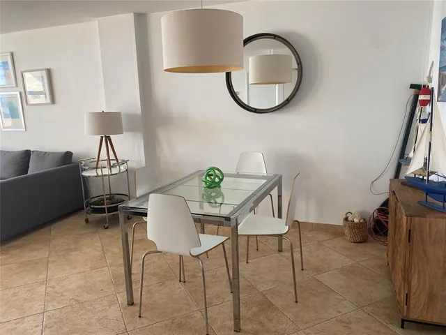 a bedroom with a bed and a lamp