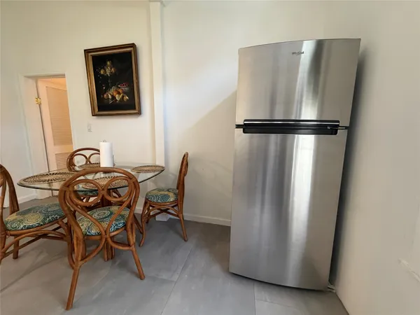 a view of a refrigerator in a kitchen