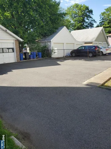a view of a car parked in front of a house