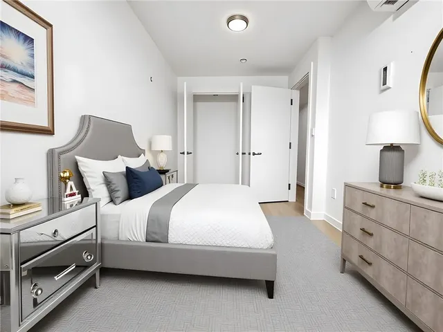 a bedroom with bed and window