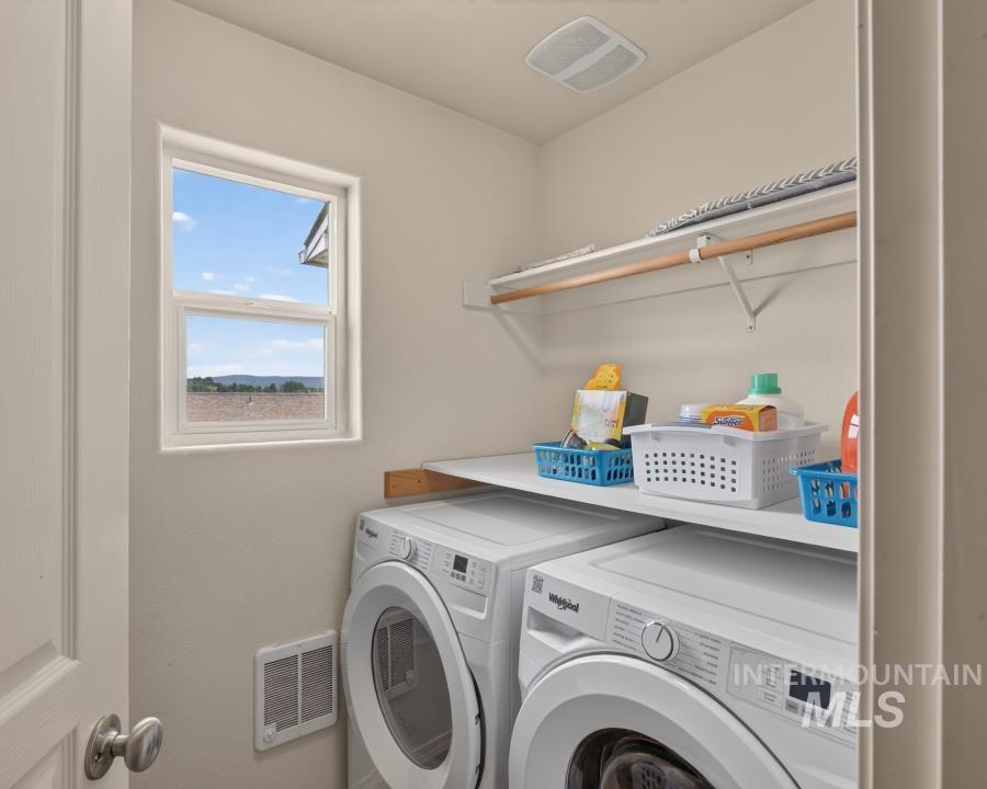 1337 Bristol Road Moscow, ID 83843 - Photo 16 of 28 Dedicated laundry area featuring a window, built-in shelving, and a hanging rod