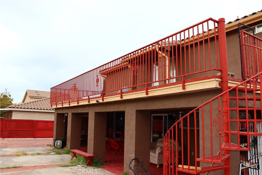 5642 Lighthouse Lane Palmdale, CA 93552 - Photo 21 of 24 a view of a large building with wooden fence