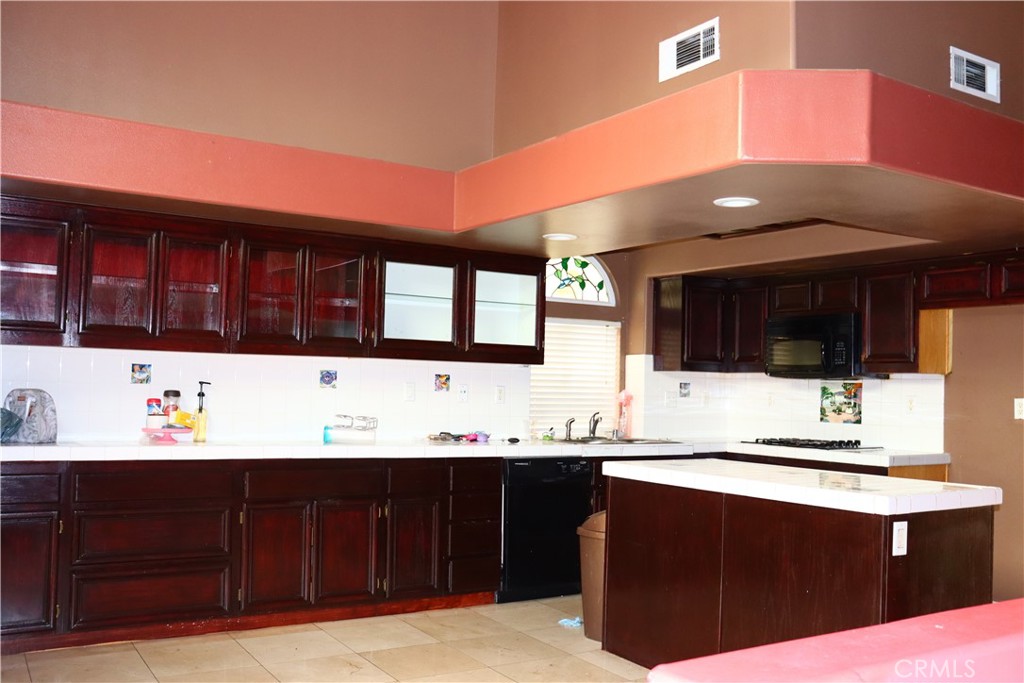 5642 Lighthouse Lane Palmdale, CA 93552 - Photo 7 of 24 a bathroom with a sink and a large mirror