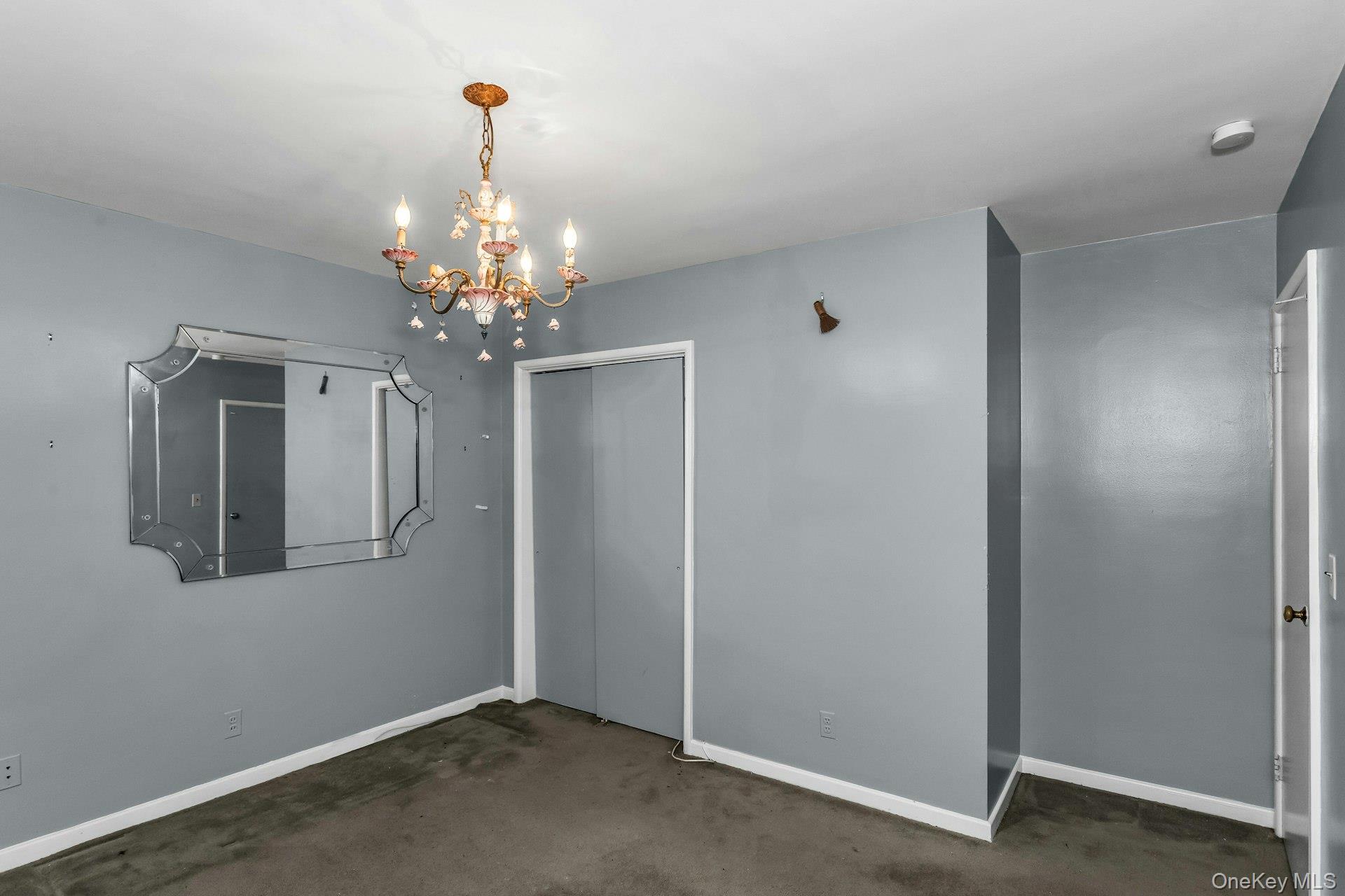 477 Demott Avenue Baldwin, NY 11510 - Photo 23 of 27 a view of a chandelier in big room and chandelier