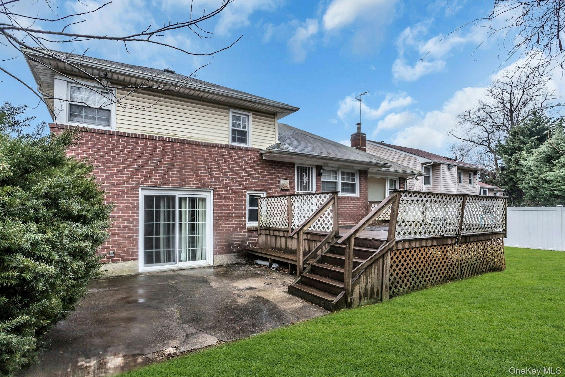 477 Demott Avenue Baldwin, NY 11510 - Photo 27 of 27 a view of a house with a yard and furniture