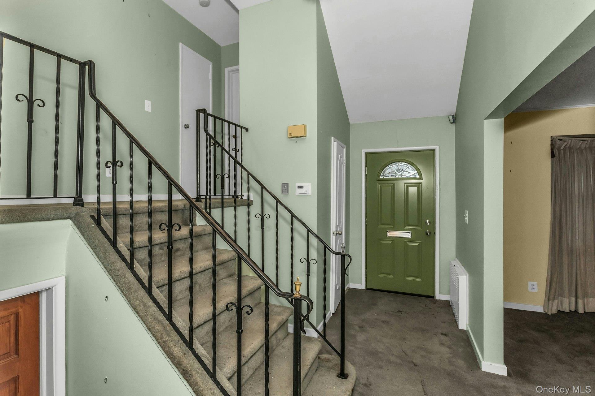 477 Demott Avenue Baldwin, NY 11510 - Photo 5 of 27 a view of entryway with wooden floor and stairs