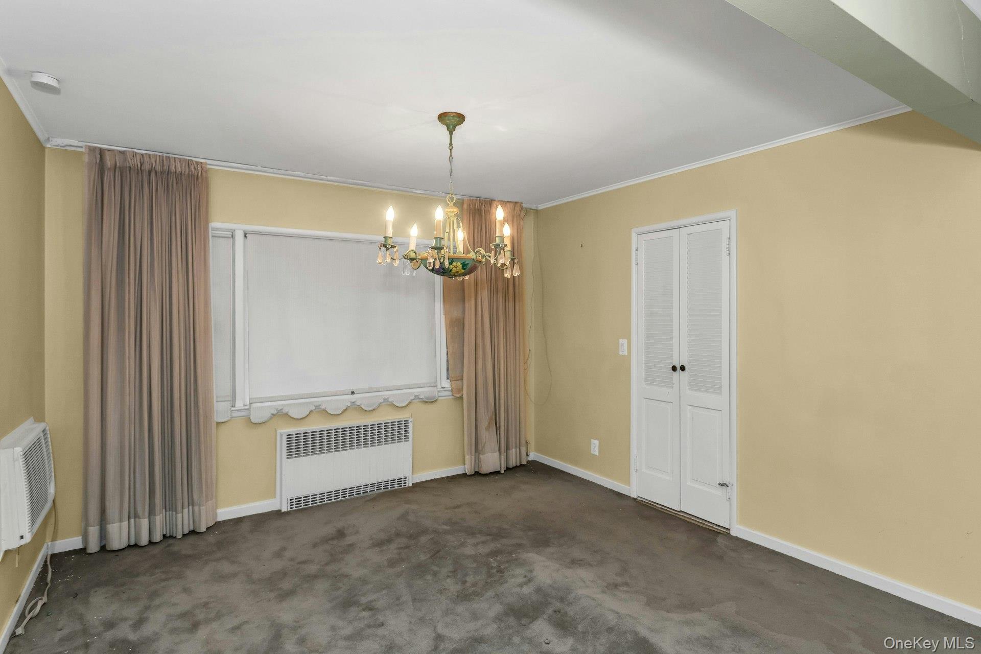 477 Demott Avenue Baldwin, NY 11510 - Photo 9 of 27 a view of a kitchen with a cabinet and chandelier