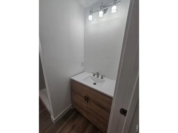 a bathroom with a sink and mirror