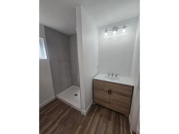 a bathroom with a sink and mirror