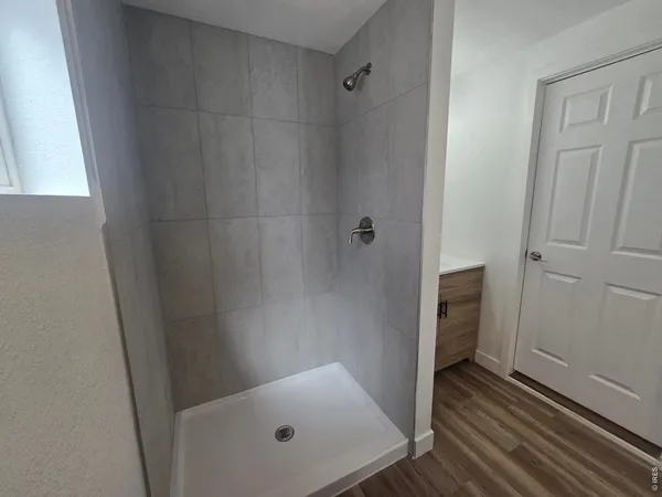 a view of a bathroom with a sink and mirror