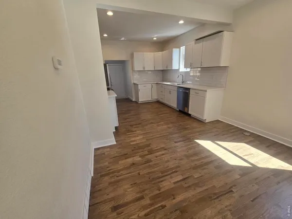 a view of kitchen with wooden floor