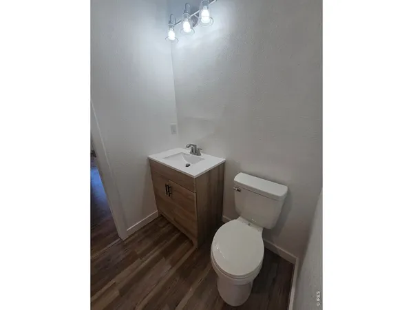 a white toilet sitting next to a bathroom sink