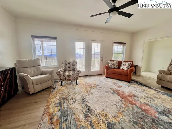 a living room with furniture and windows