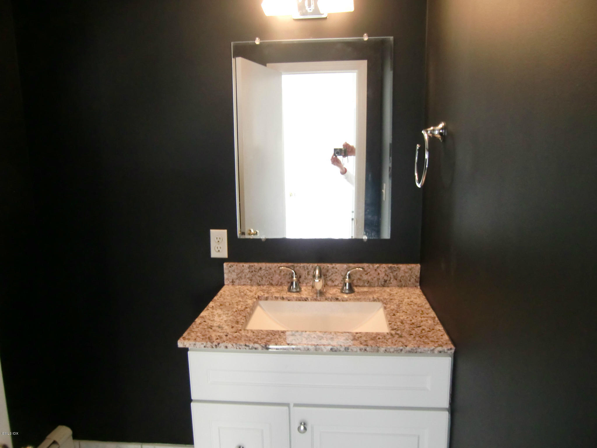42 Harold Street Cos Cob, CT 06807 - Photo 9 of 10 a bathroom with a granite countertop sink and a mirror
