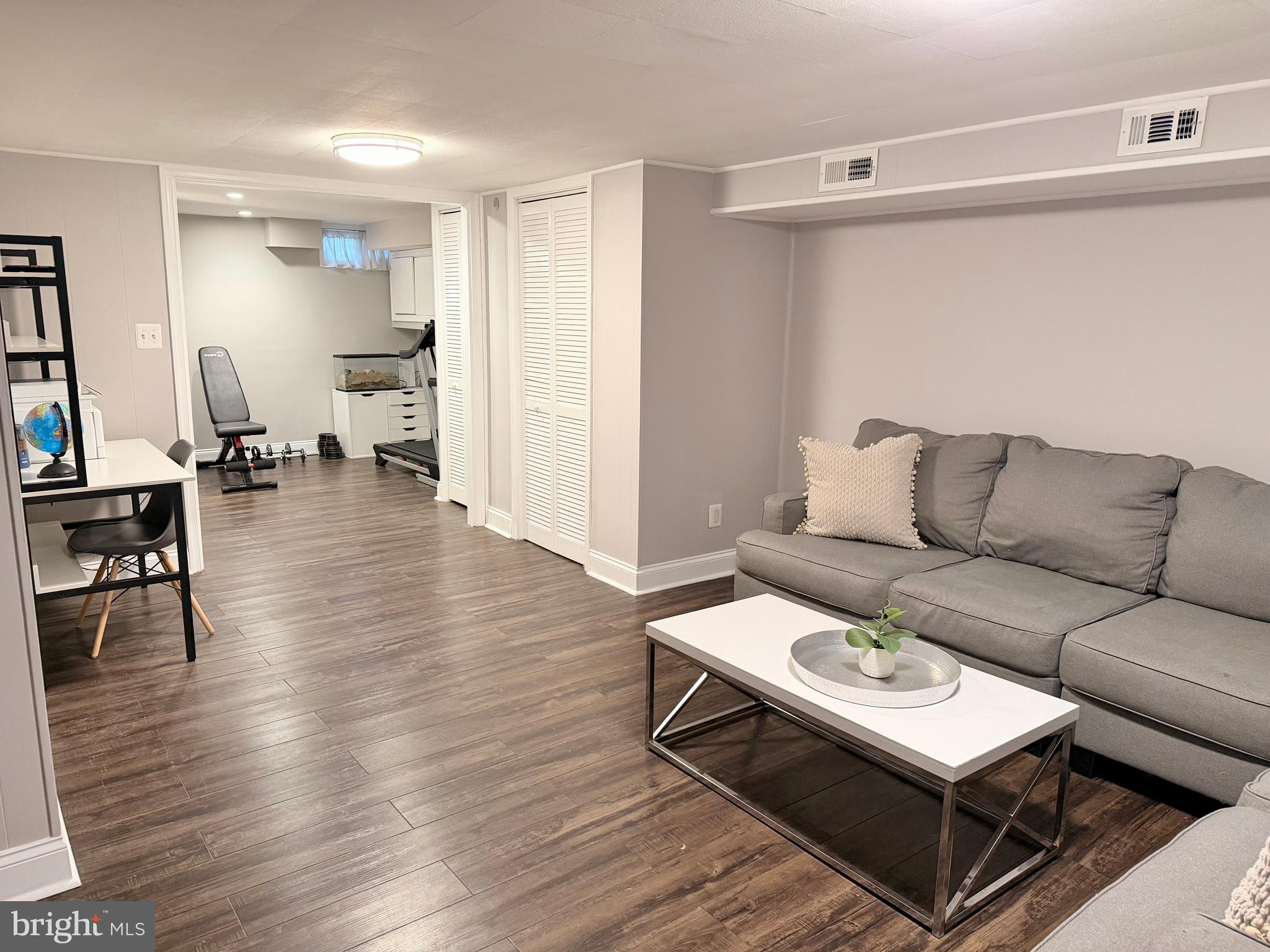 2235 Southorn Road Baltimore, MD 21220 - Photo 21 of 33 a living room with furniture and a wooden floor