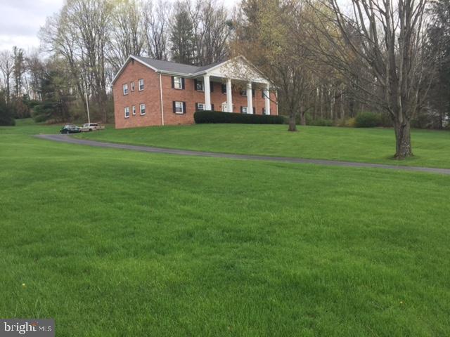 2990 Buffalo Run Road Bellefonte, PA 16823 - Photo 1 of 12 a front view of a house with a yard