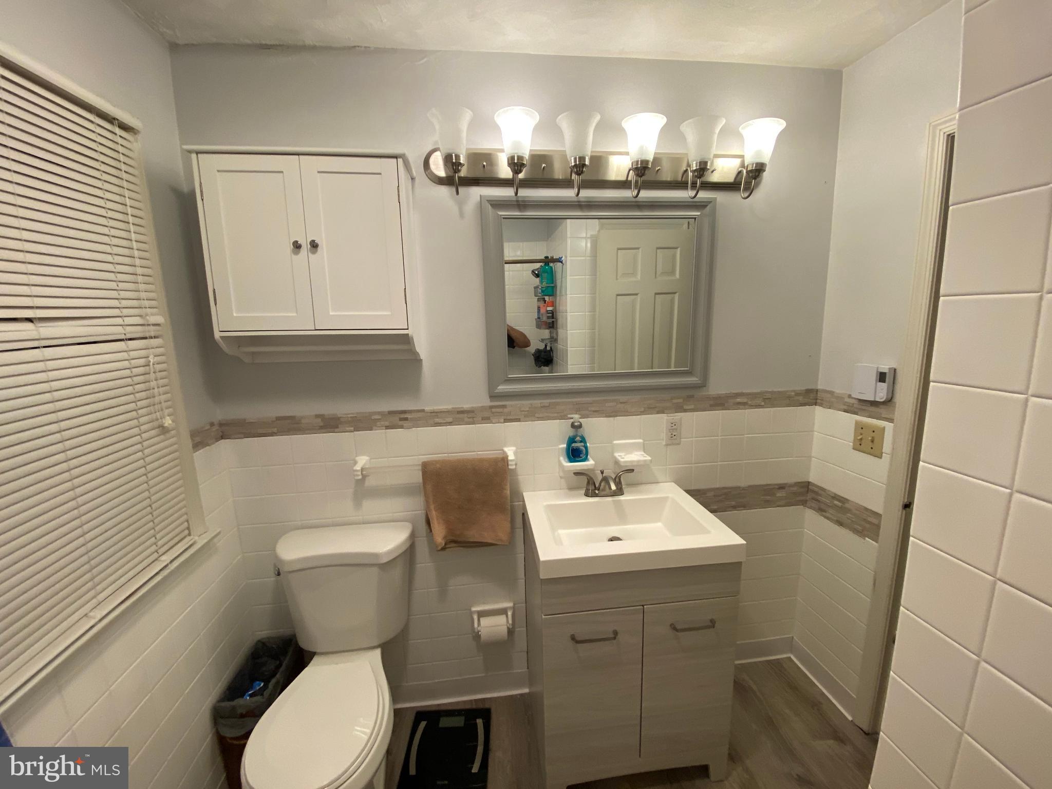 2990 Buffalo Run Road Bellefonte, PA 16823 - Photo 6 of 12 a bathroom with a toilet sink and mirror