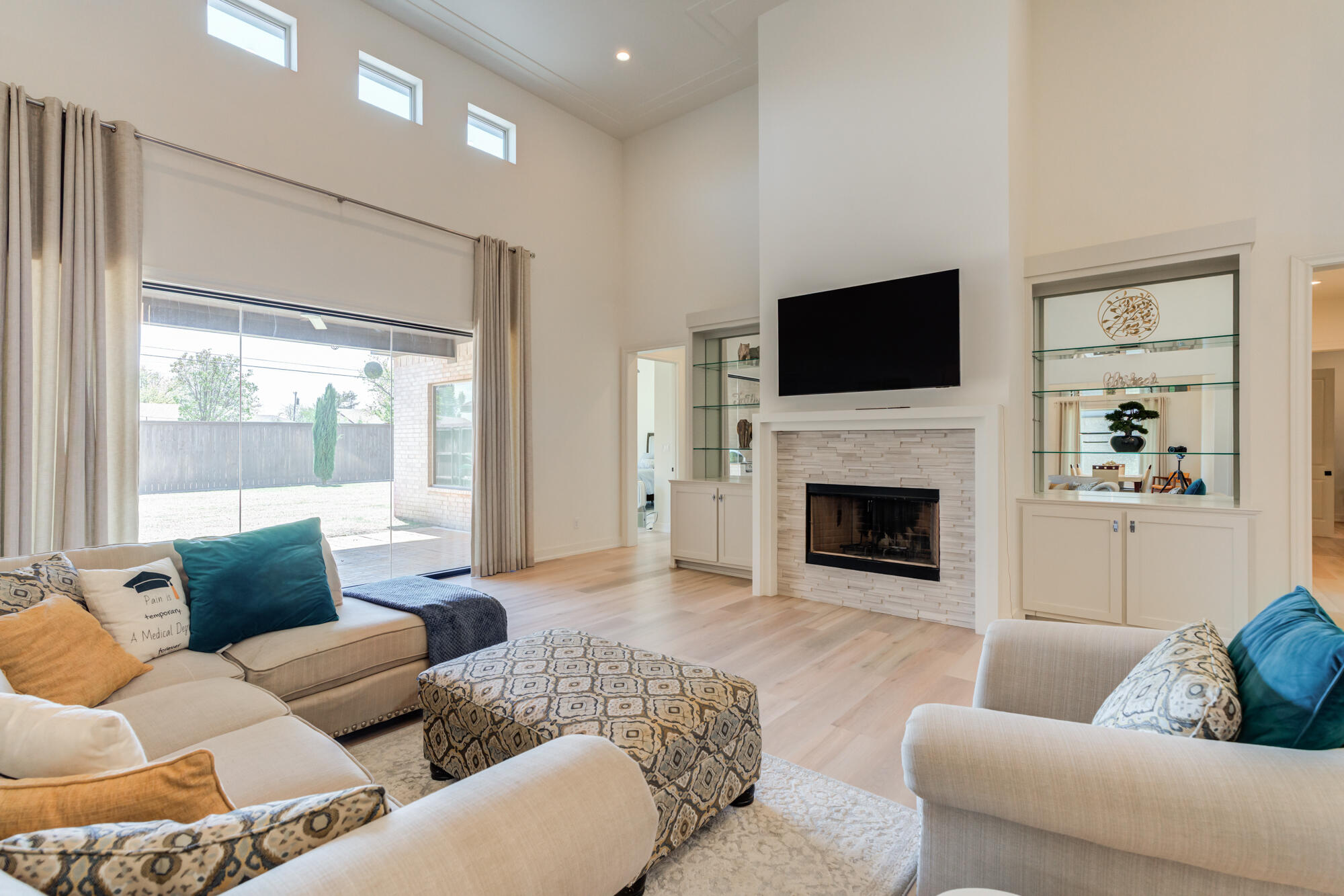 4813 5th Street Lubbock, TX 79416 - Photo 2 of 62 a living room with furniture fireplace and flat screen tv