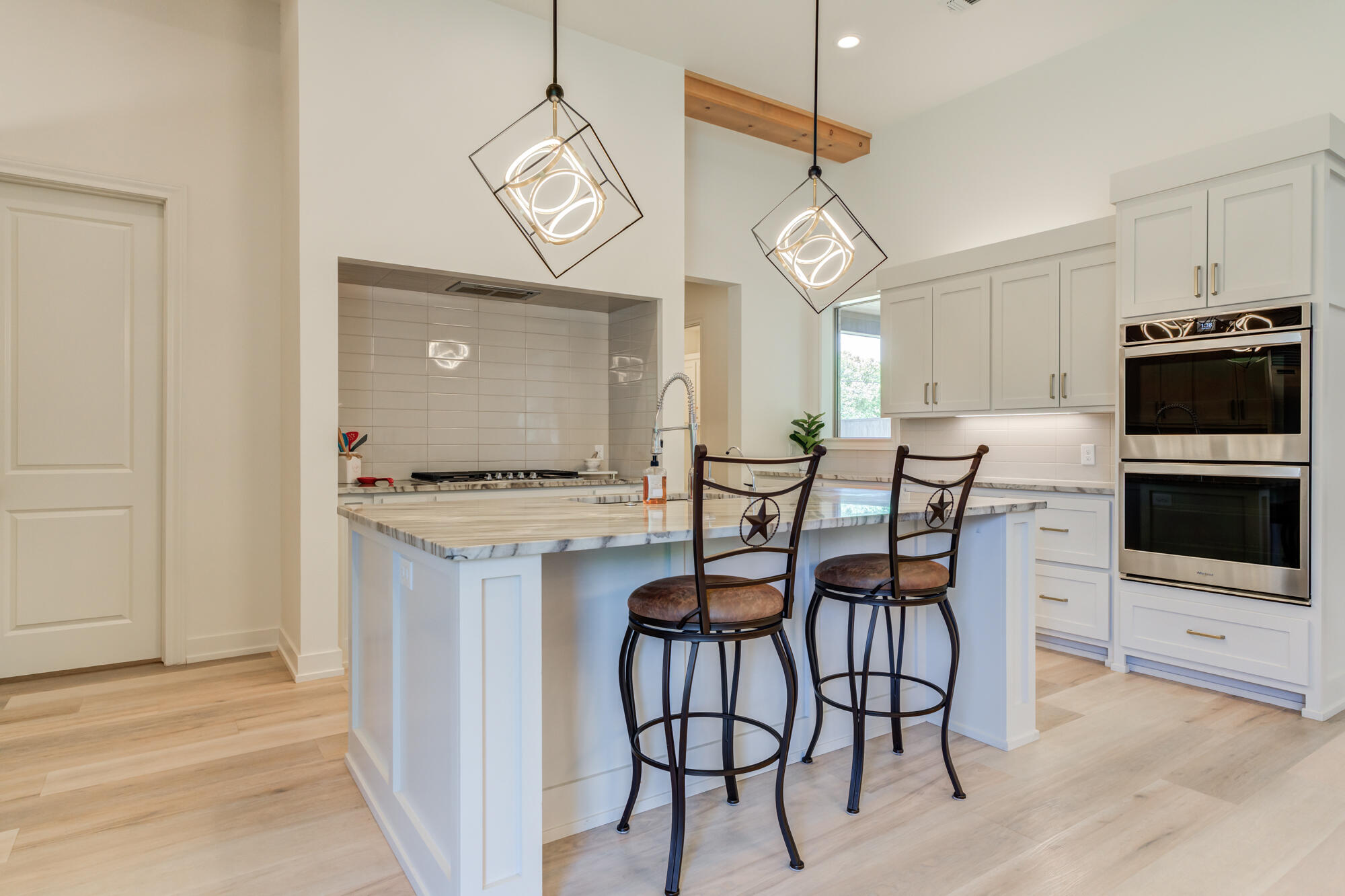 4813 5th Street Lubbock, TX 79416 - Photo 21 of 62 a view of a dining room with furniture wooden floor and chandelier