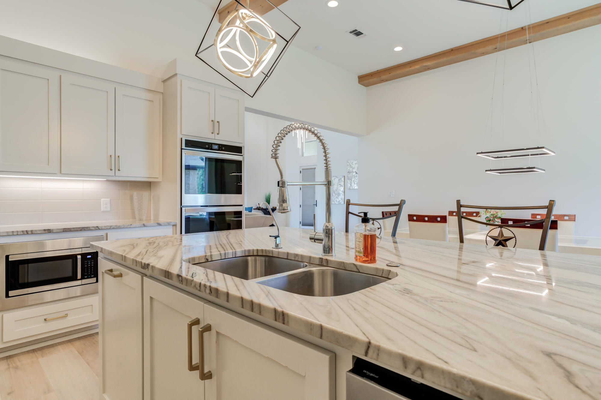 4813 5th Street Lubbock, TX 79416 - Photo 24 of 62 a kitchen with a sink a stove and cabinets