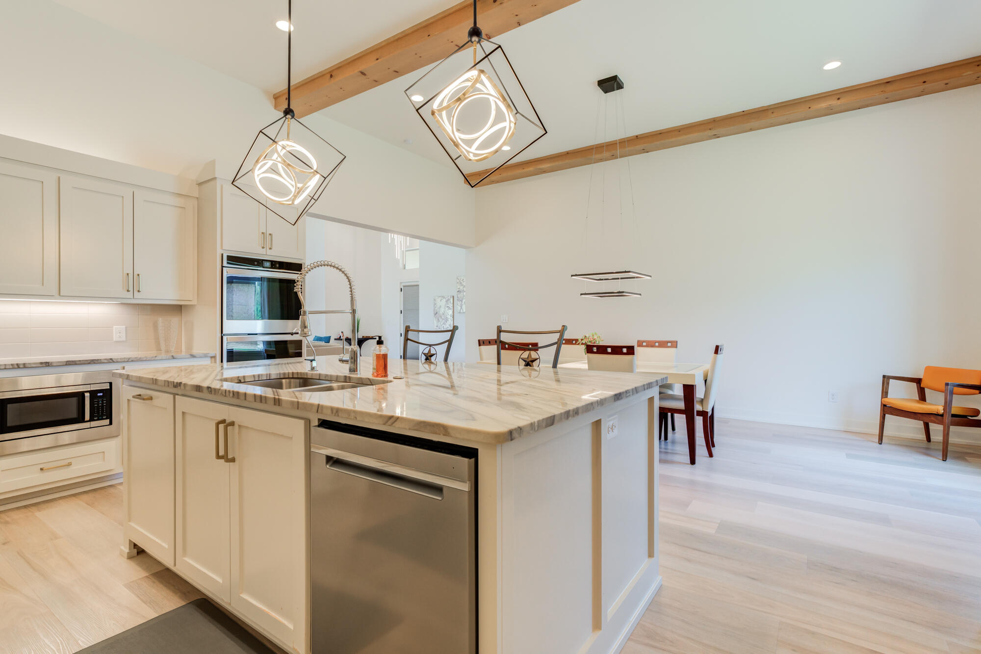 4813 5th Street Lubbock, TX 79416 - Photo 27 of 62 a kitchen with a sink cabinets and wooden floor