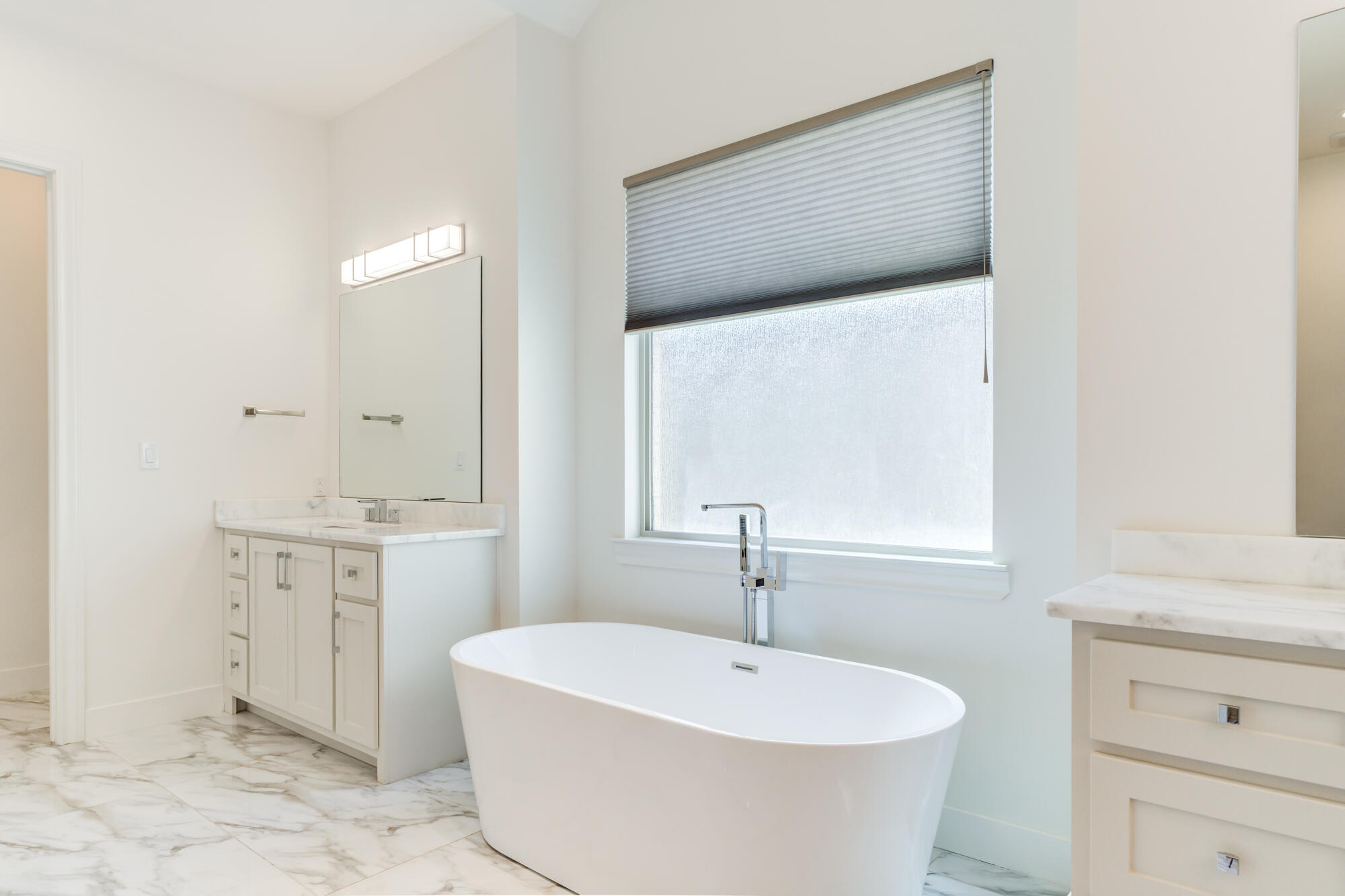 4813 5th Street Lubbock, TX 79416 - Photo 36 of 62 a bathroom with a sink and a bathtub