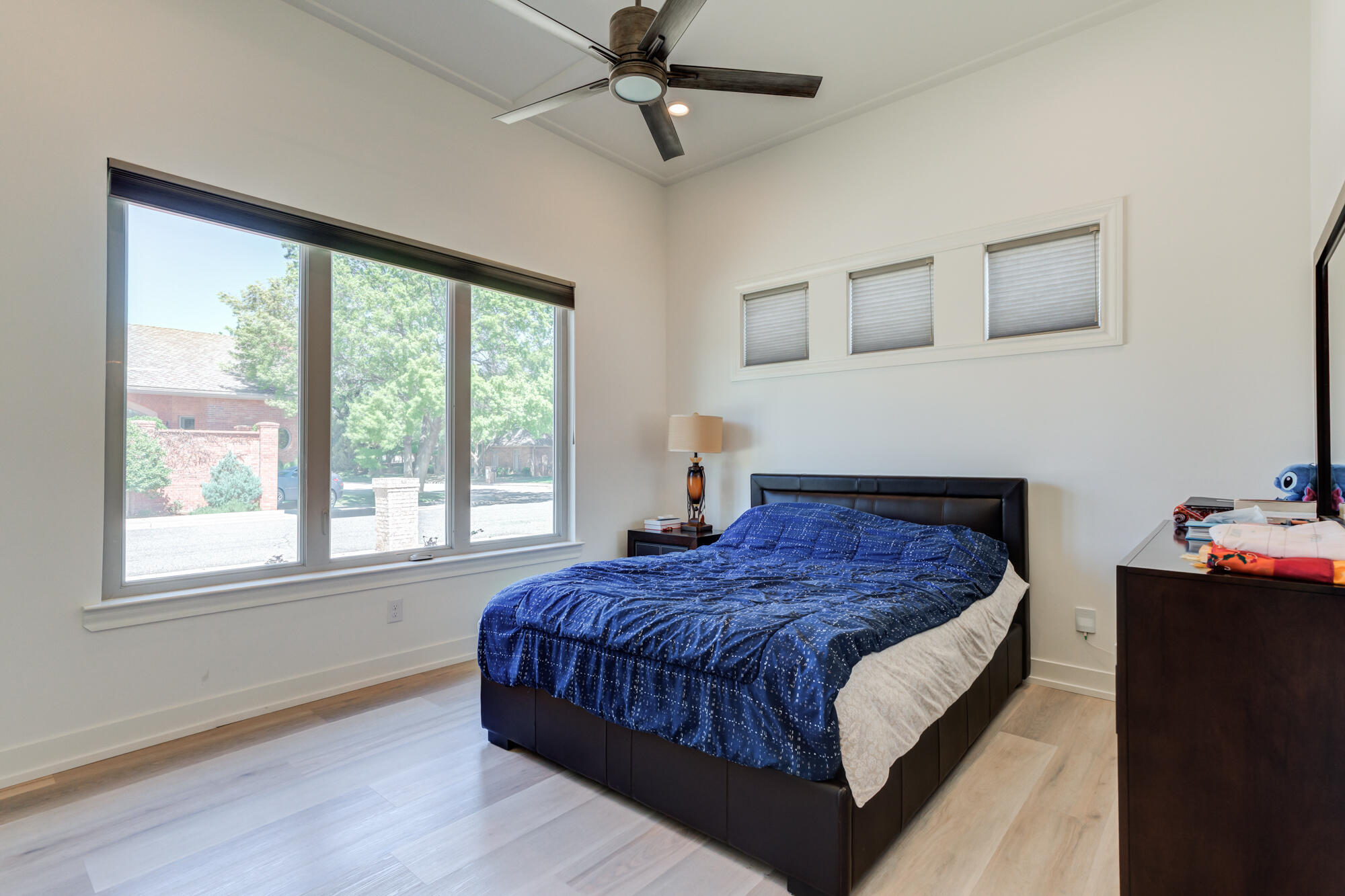 4813 5th Street Lubbock, TX 79416 - Photo 37 of 62 a bedroom with a bed window and a dresser