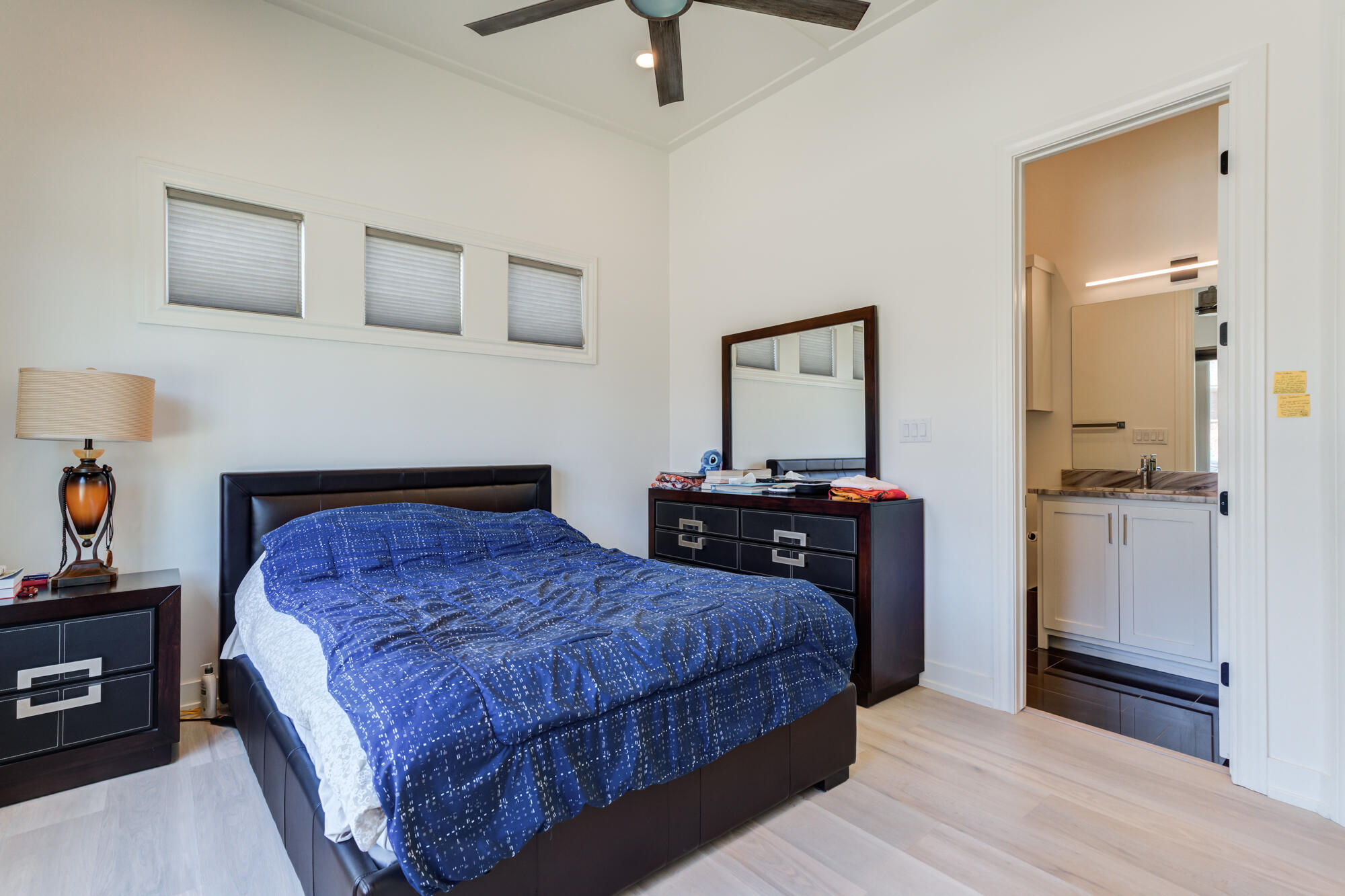 4813 5th Street Lubbock, TX 79416 - Photo 38 of 62 a bedroom with a bed and wooden floor
