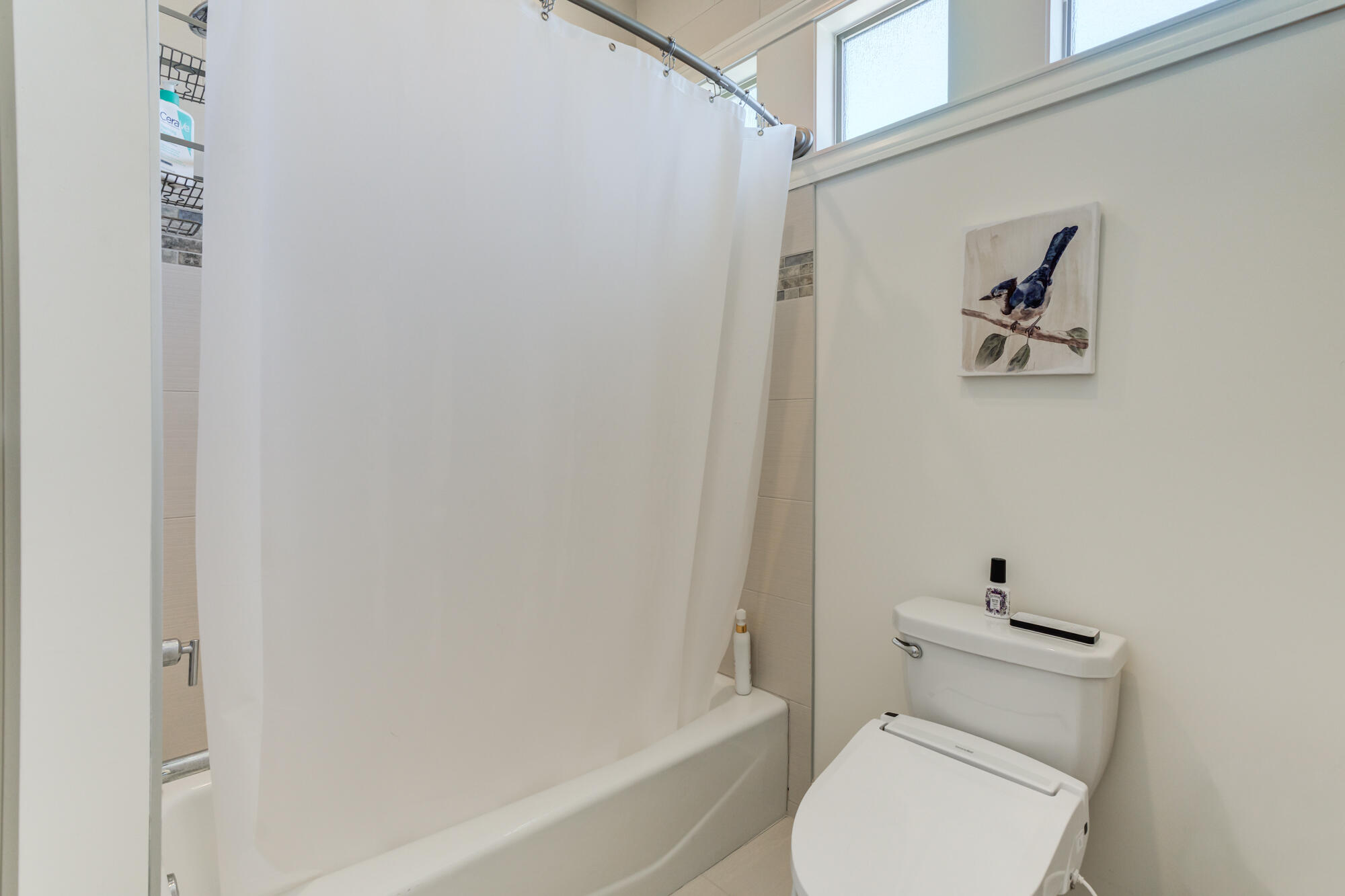 4813 5th Street Lubbock, TX 79416 - Photo 45 of 62 a bathroom with a toilet and a bathtub