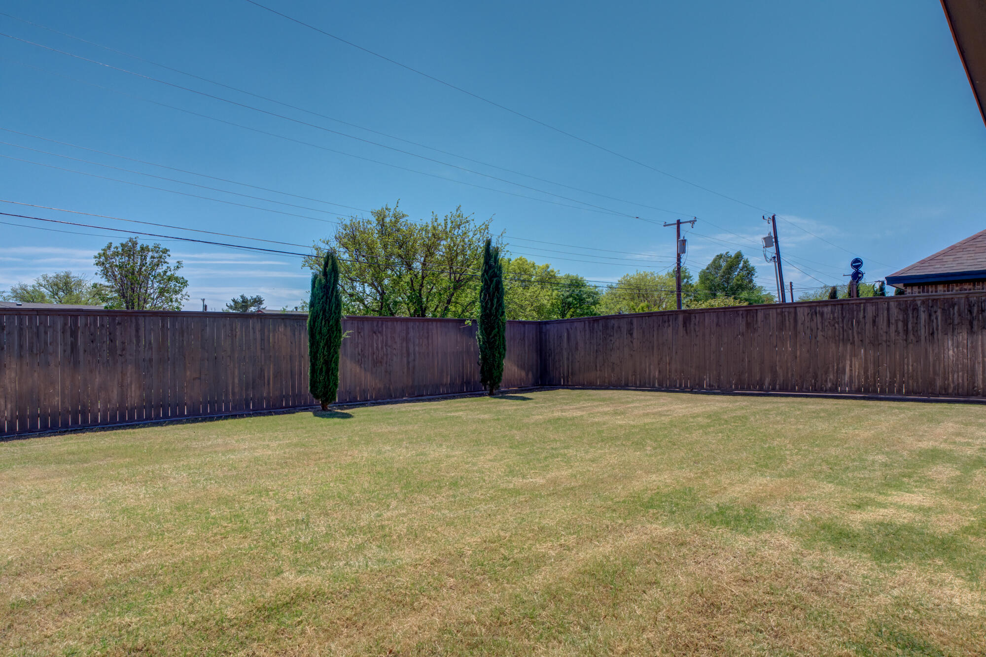 4813 5th Street Lubbock, TX 79416 - Photo 5 of 62 a view of basketball place with wooden fence