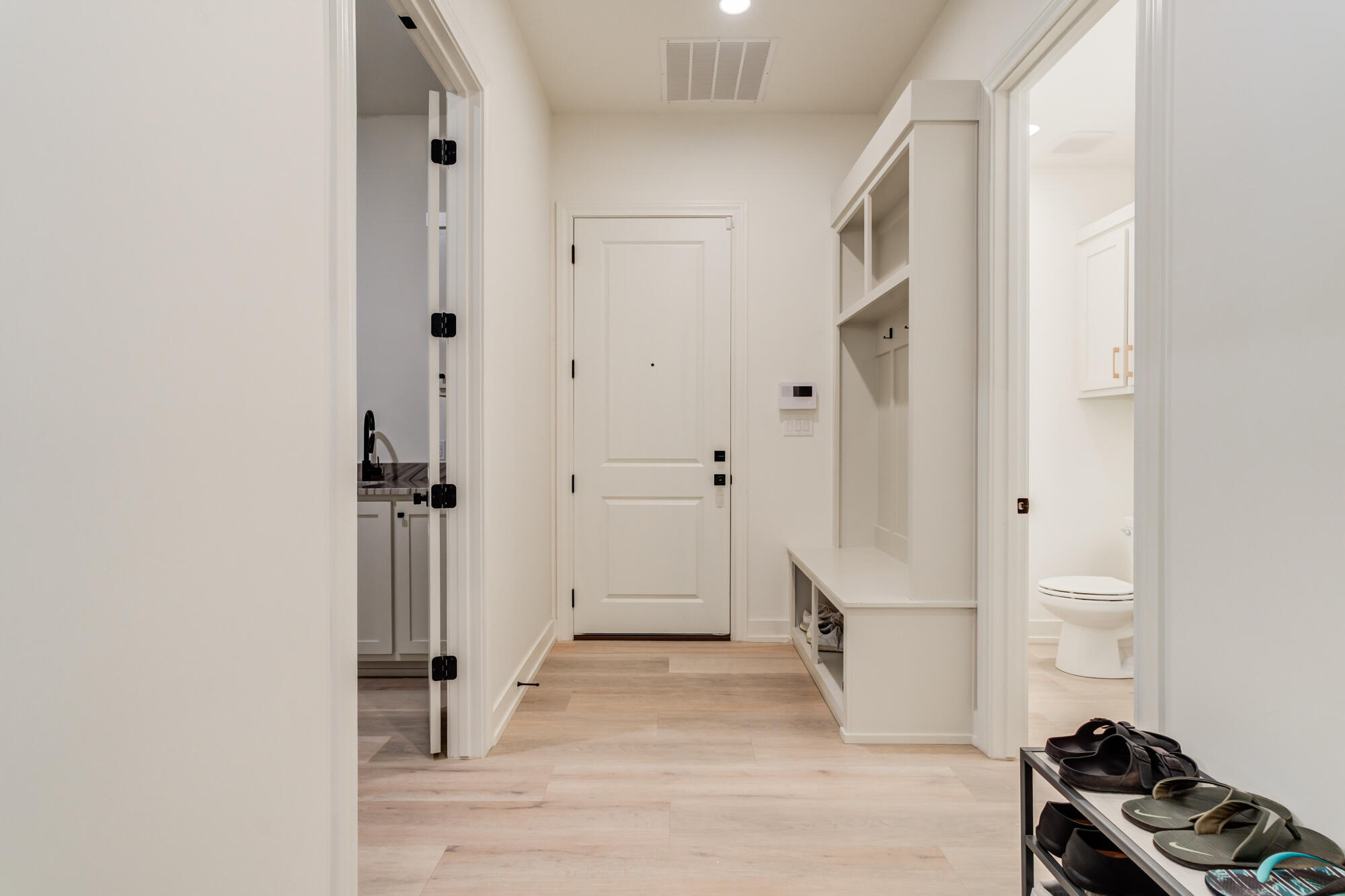 4813 5th Street Lubbock, TX 79416 - Photo 53 of 62 a view of a livingroom with wooden floor and bathroom