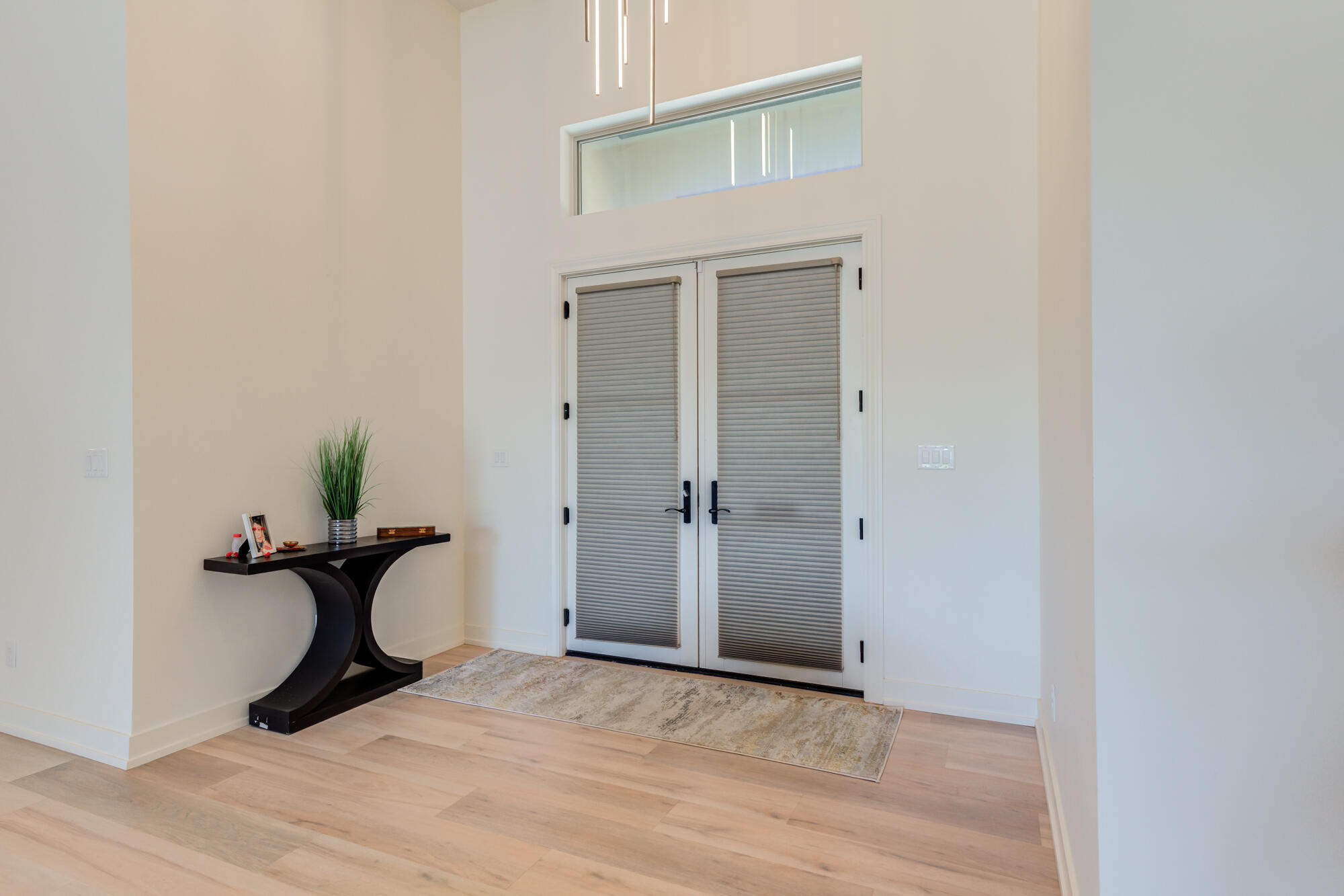 4813 5th Street Lubbock, TX 79416 - Photo 10 of 62 a view of a livingroom with a chandelier and wooden floor