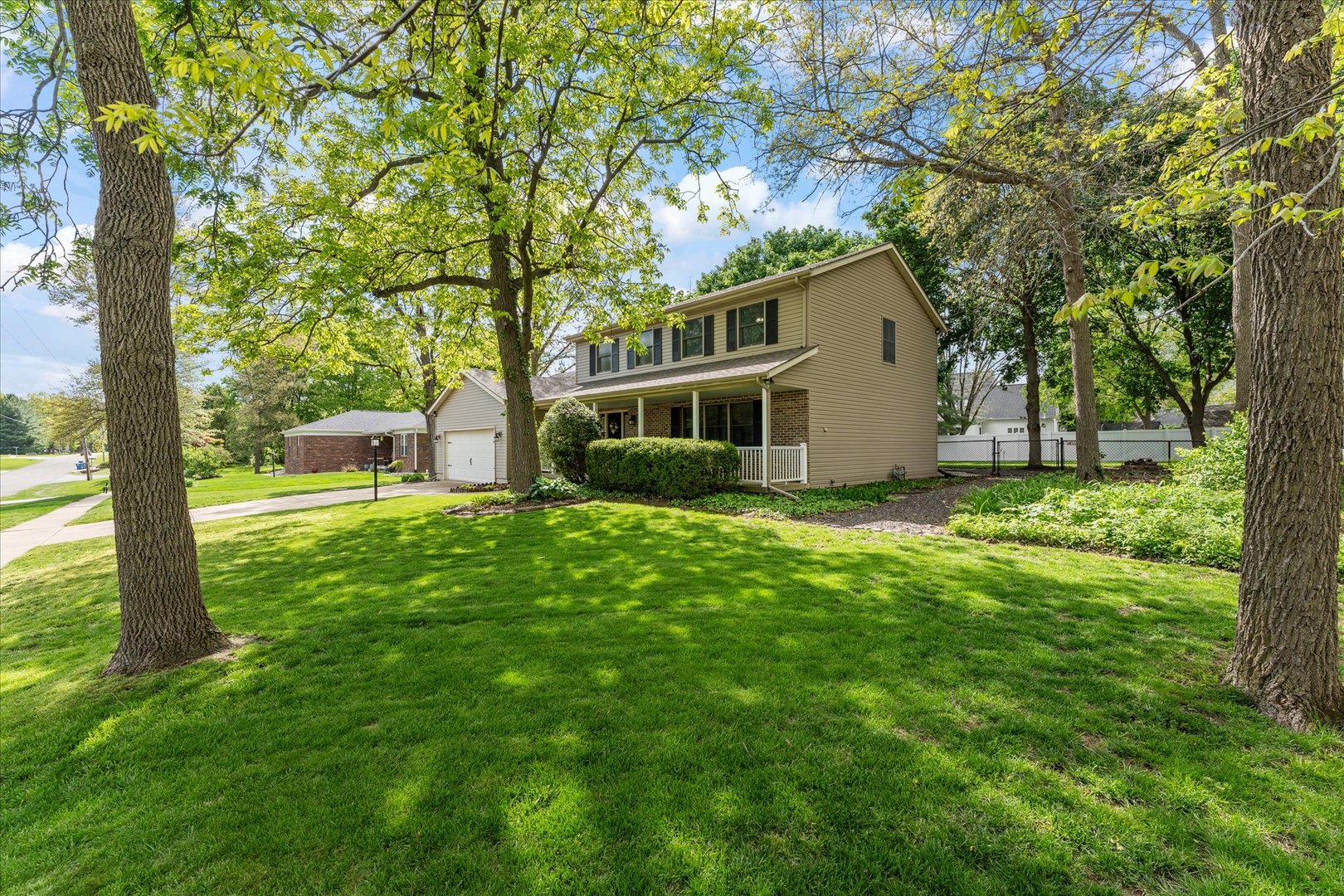 789 County Farm Road Monticello, IL 61856 - Photo 2 of 36 a house view with a garden and trees