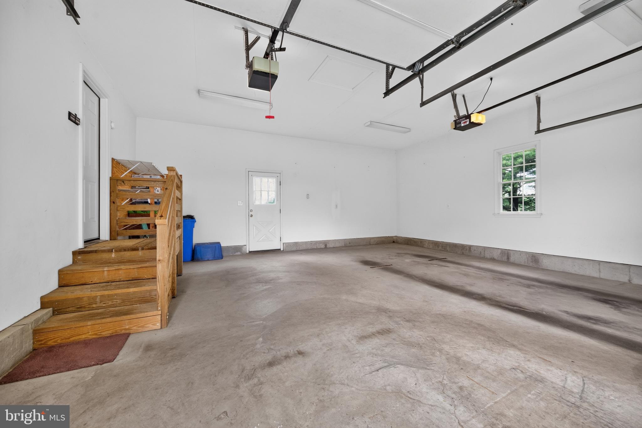 13835 Howard Road Dayton, MD 21036 - Photo 34 of 43 Large two car garage with storage and high ceiling