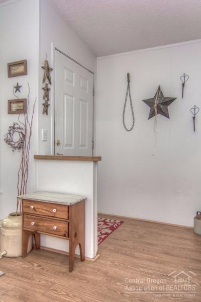 60041 Hopi Road Bend, OR 97702 - Photo 5 of 19 a view of a room with rack and wooden floor