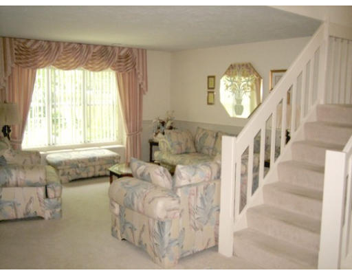 103 D Ridgefield Circle, Unit D Clinton, MA 01510 - Photo 6 of 12 a living room with furniture and a large window