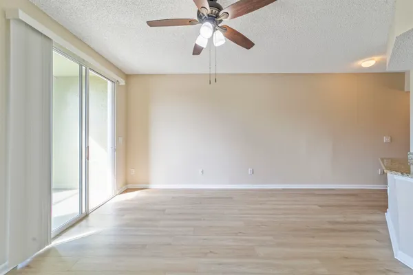 a kitchen with cabinets stainless steel appliances a sink and a window