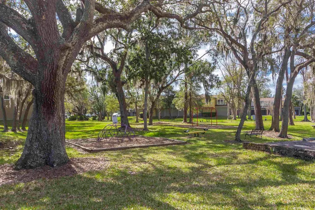a view of a palm trees in front of a house