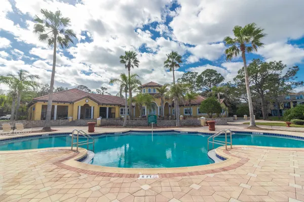 a view of a hallway with wooden floor and entryway