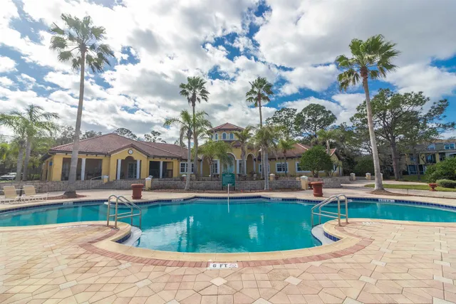 a view of a hallway with wooden floor and entryway
