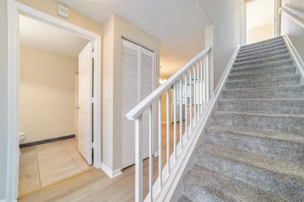 a white toilet sitting next to a bath tub shower