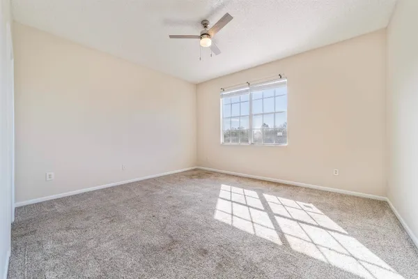 a white bath tub sitting next to a white toilet