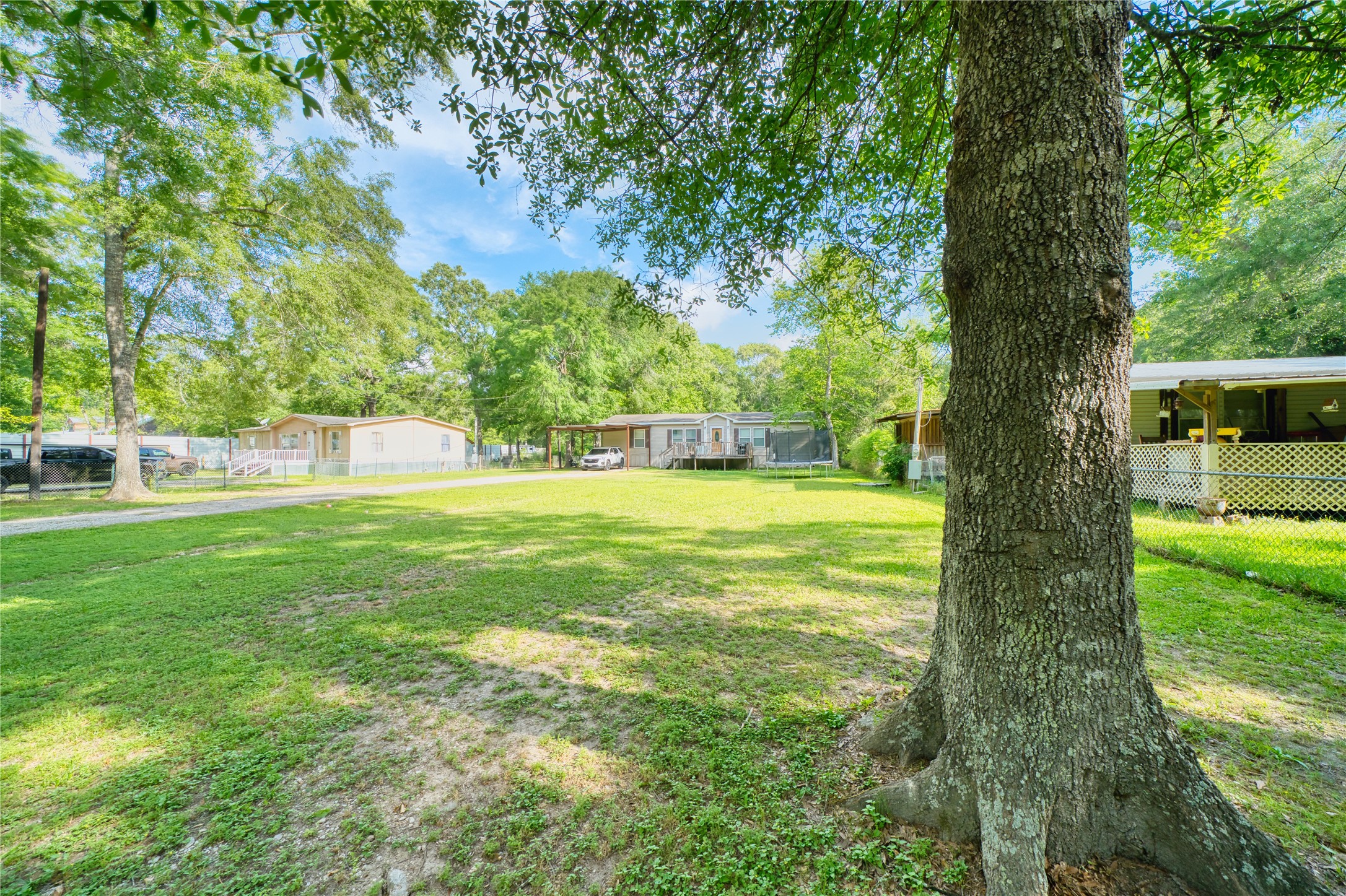 103 County Road 370 Splendora, TX 77372 - Photo 5 of 32 a view of swimming pool with an outdoor space and seating area