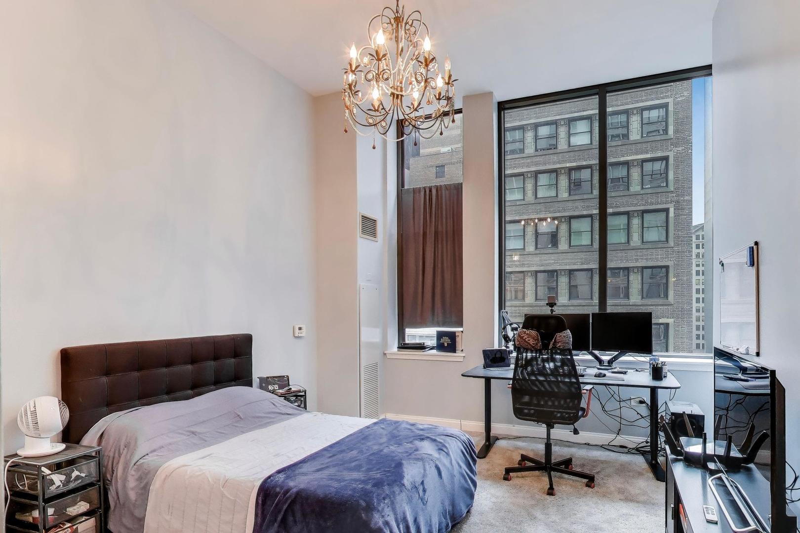 8 West Monroe Street, Unit 704 Chicago, IL 60603 - Photo 17 of 35 a bedroom with a workspace