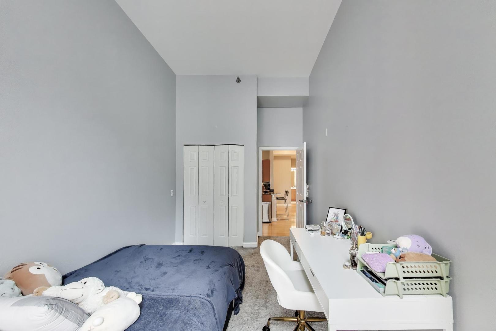 8 West Monroe Street, Unit 704 Chicago, IL 60603 - Photo 26 of 35 a living room with furniture and baby crib
