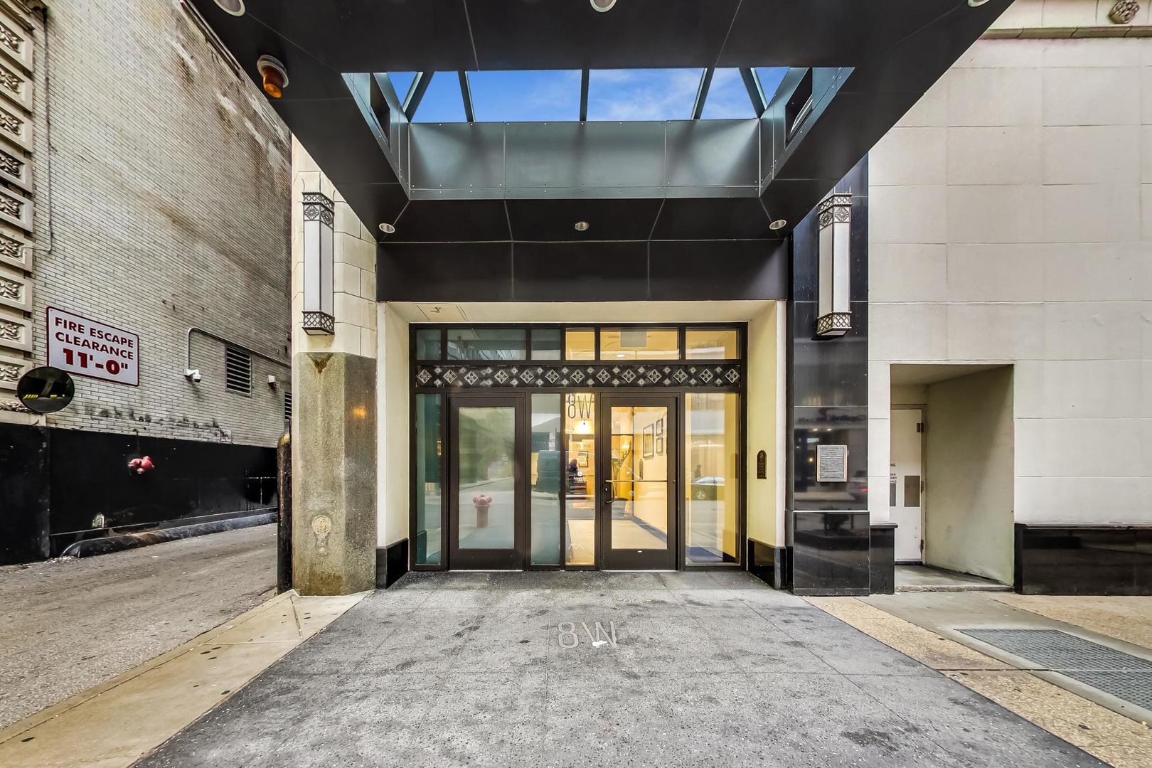 8 West Monroe Street, Unit 704 Chicago, IL 60603 - Photo 4 of 35 a view of a building with an entryway and an empty space