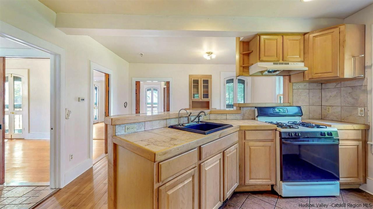322 Main Street Rosendale, NY 12472 - Photo 12 of 35 a kitchen that has a sink and a stove in it