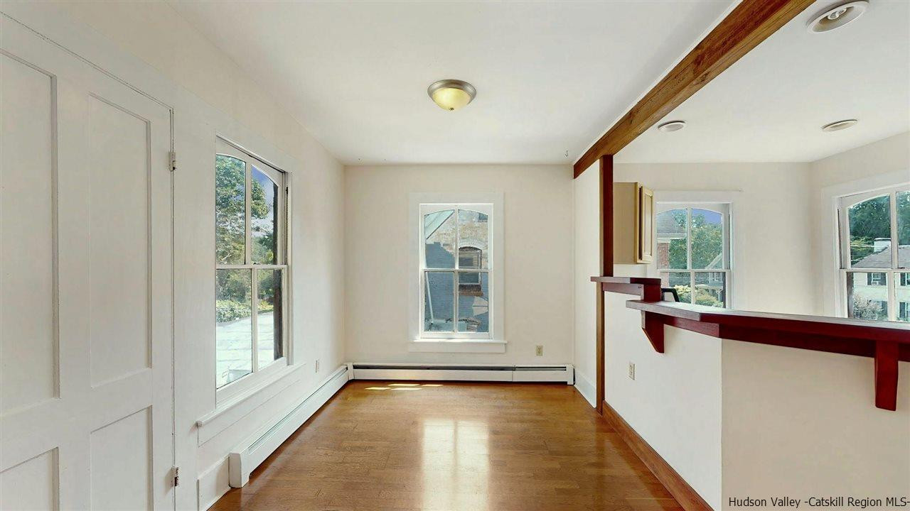 322 Main Street Rosendale, NY 12472 - Photo 25 of 35 a view of a big room with wooden floor and windows