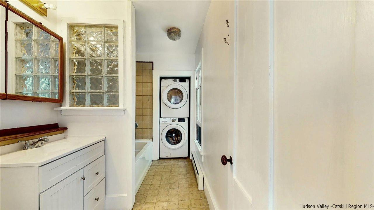 322 Main Street Rosendale, NY 12472 - Photo 26 of 35 a bathroom with a granite countertop tub and a window