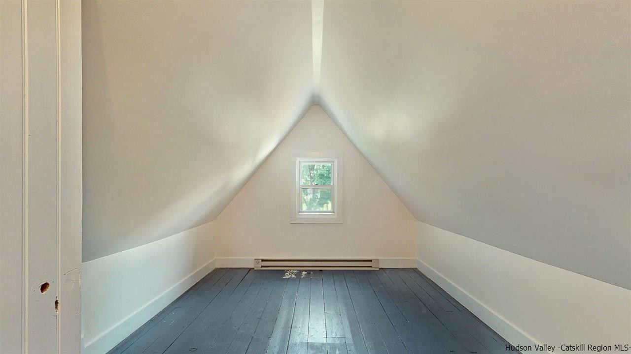 322 Main Street Rosendale, NY 12472 - Photo 34 of 35 an empty room with wooden floor and windows
